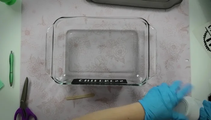 Carefully wipe away remaining etching cream with baby wipes, avoiding excessive rubbing on the glass.