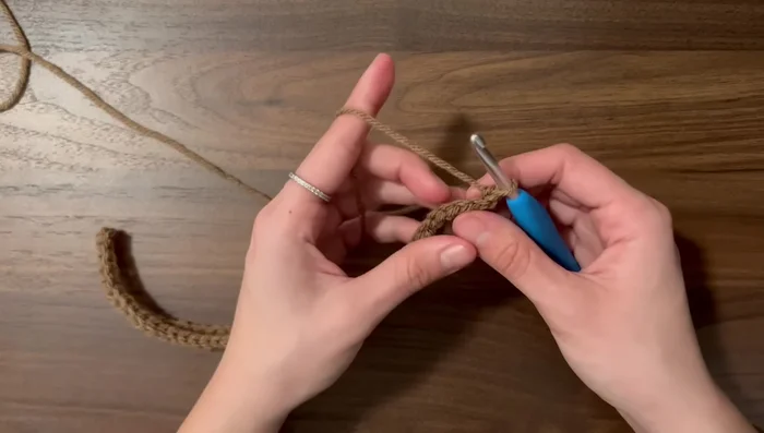 Continue rows until the hdc side fits snugly around your head (about 54 rows in this example).