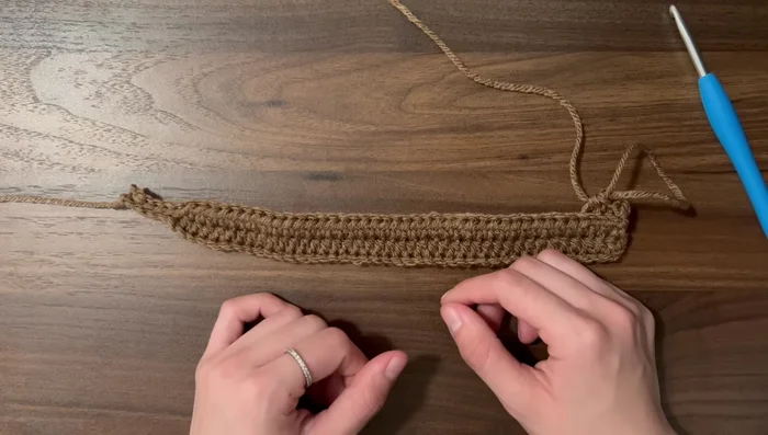 Continue rows until the hdc side fits snugly around your head (about 54 rows in this example).