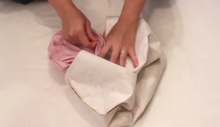 Finish: Iron the top edge, turn in the seam allowance at the opening, and top stitch all the way around to close the hole.