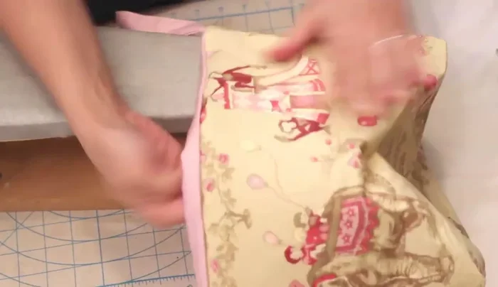 Finish: Iron the top edge, turn in the seam allowance at the opening, and top stitch all the way around to close the hole.