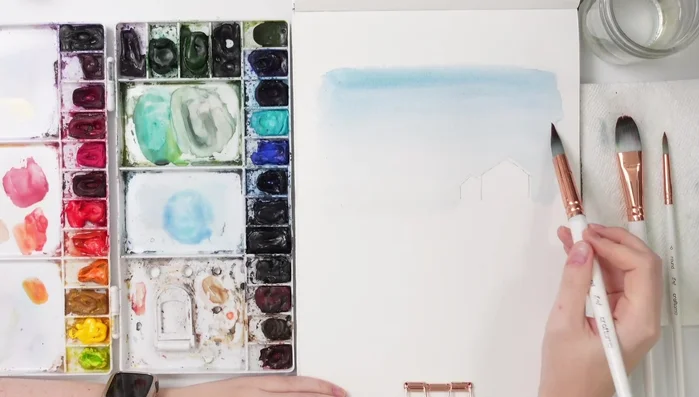 While the background is still wet, paint loose, faded trees using turquoise and sap green, keeping the strokes light and vertical.