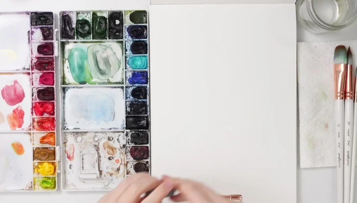 Sketch a simple, off-centered house with a garage.