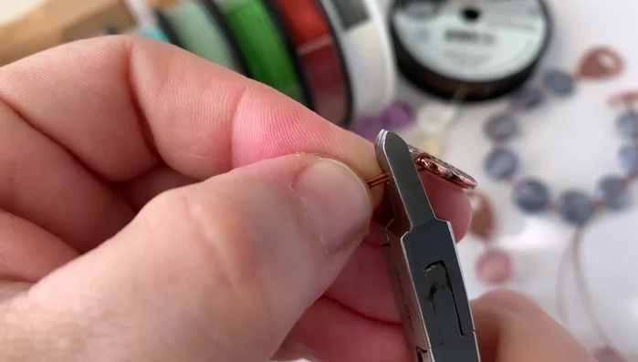 Crimp the first tube: Use crimping pliers to securely crimp the tube, creating a strong connection to the clasp.