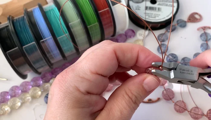 Repeat steps 3-5: Continue adding beads and crimping tubes until you have reached the desired bracelet length.