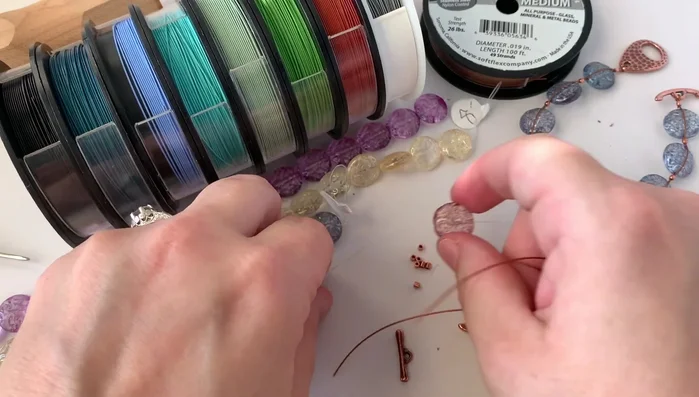 Crimp the final tube: Securely crimp the final tube, ensuring the clasp is positioned correctly on the outside of the loop.