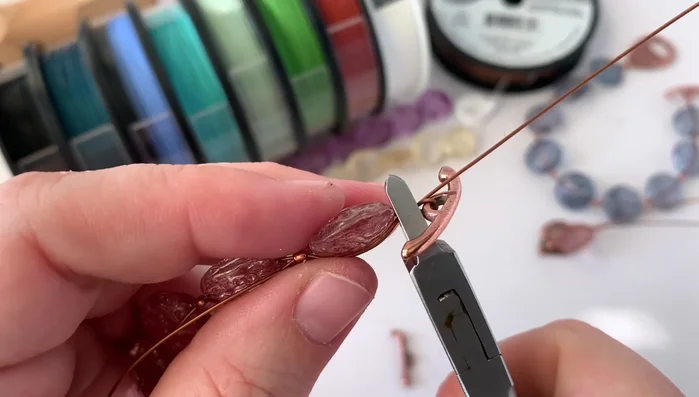 Crimp the final tube: Securely crimp the final tube, ensuring the clasp is positioned correctly on the outside of the loop.