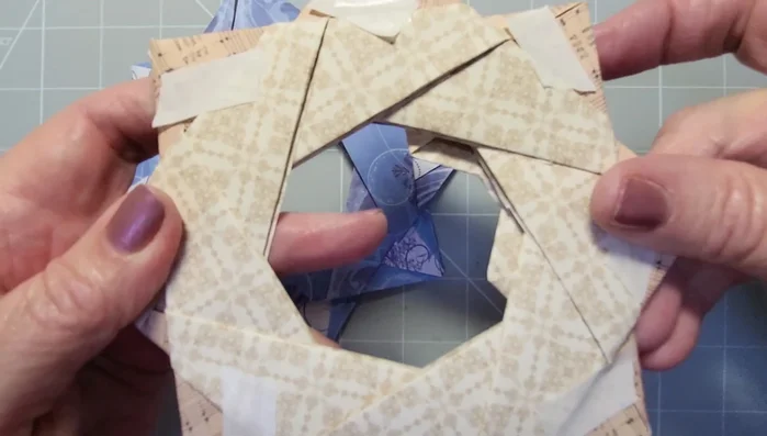 Secure the wreath by taping the folded-over sections.