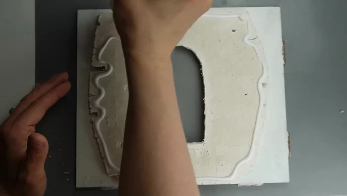 Apply a base coat of grout color, ensuring it gets into all lines. (Generous amount of paint and vertical brush strokes recommended).