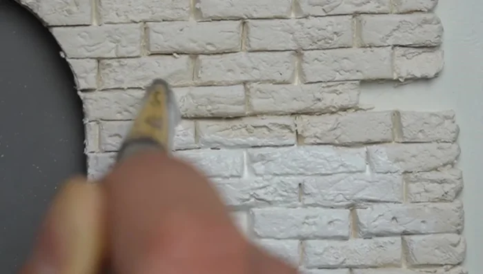 Apply a base coat of grout color, ensuring it gets into all lines. (Generous amount of paint and vertical brush strokes recommended).