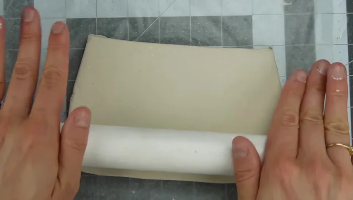 Cut the clay to the size of your wall, using a template if needed.