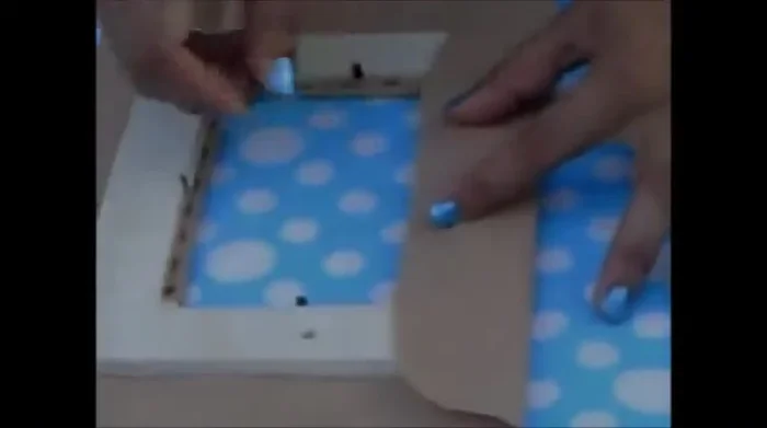 Mark and slice for the metal posts. Mark the location of the metal posts on the fabric. Make small slices at these marks to accommodate the posts.