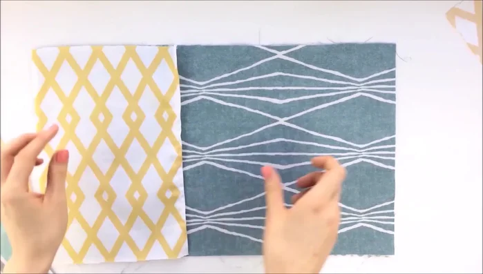 Sew the pockets securely to the fabric panels.