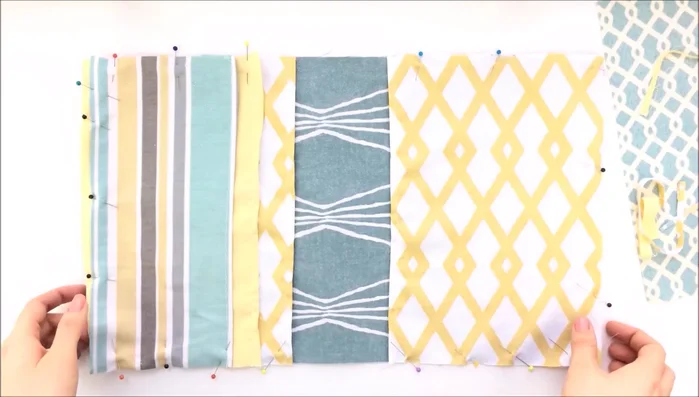 Sew the pockets securely to the fabric panels.