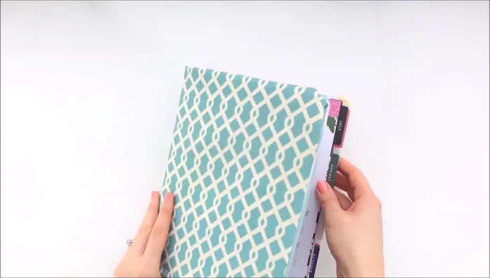 Attach the planner rings. Add an elastic band closure (or another fastening method).