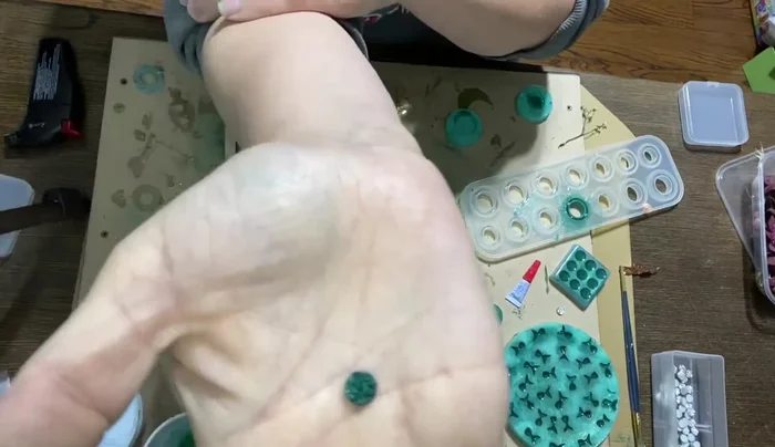 Allow the finished resin pieces to cure for at least one week before attaching them to earring posts using a strong adhesive like E6000.