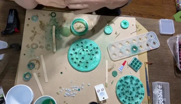 Allow the finished resin pieces to cure for at least one week before attaching them to earring posts using a strong adhesive like E6000.