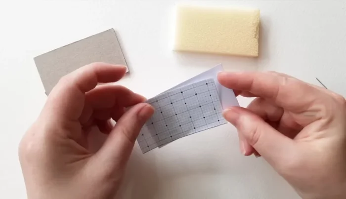 Transfer button template to lightweight card using pins.