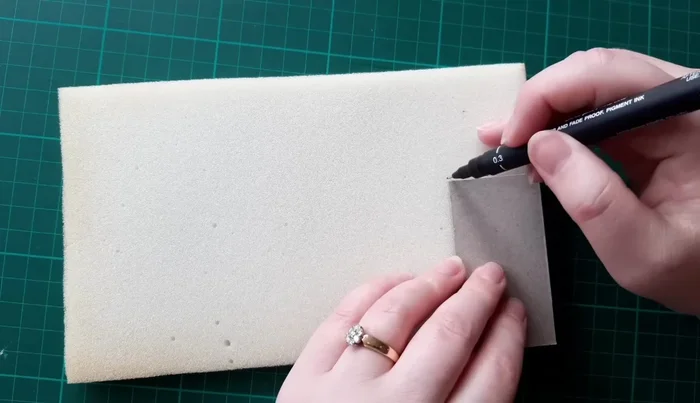 Transfer button template to lightweight card using pins.