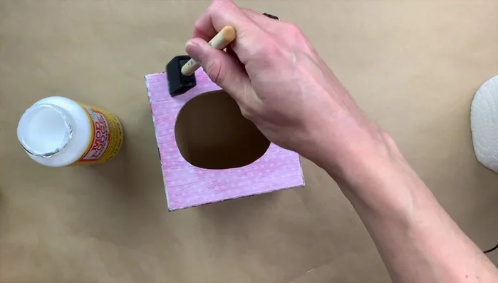 Gently sand the box to smooth any rough edges. 