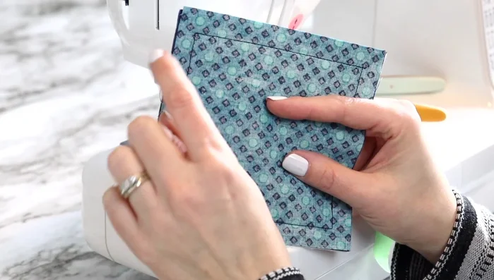 Turn right-side out: Turn the coaster right-side out through the open section. Use fingers or a chopstick to poke out the corners.