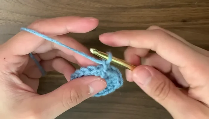 Round 6: Single crochet in every stitch (no increases). Continue with single crochet rounds until desired stripe length is reached. (The tutorial uses 3 rounds of blue, 2 rounds of white, 2 rounds of blue, and 2 rounds of white.)