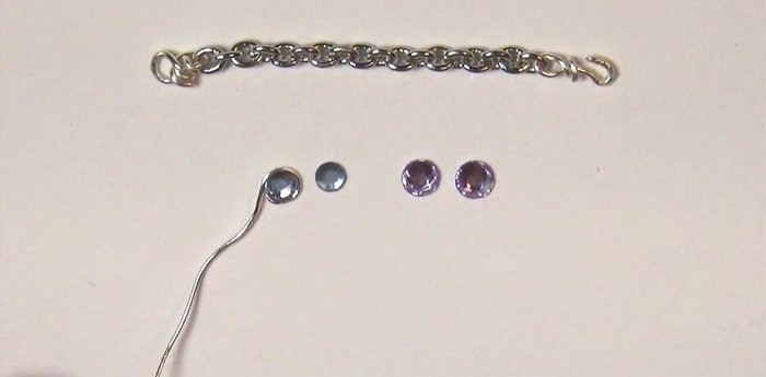 Make clay charms. Bend wire, insert into clay, and bake. Paint with silver alcohol ink after baking.