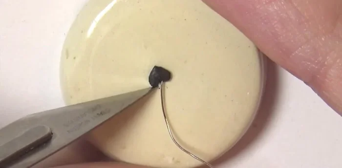 Attach charms to chain using tiny jump rings made from wire.