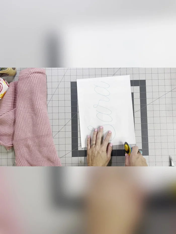 Lightly trim the excess stabilizer, leaving a generous border around your name.