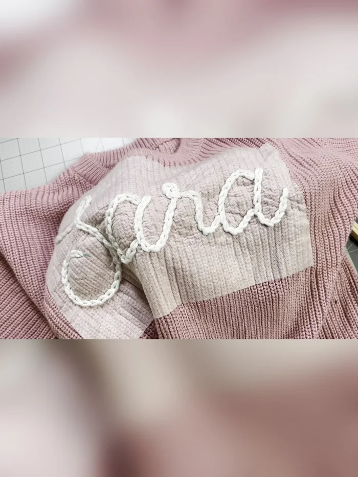 Wash away remaining stabilizer by running warm water over the sweater and gently agitating with your fingers. Air dry or tumble dry.