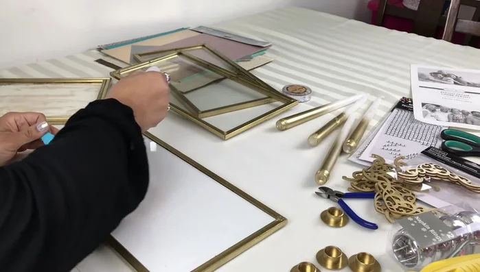 Attach side panels to the base: Use Rapid Fuse glue (or E6000) and hot glue to attach the side panels to the base frame, ensuring alignment.