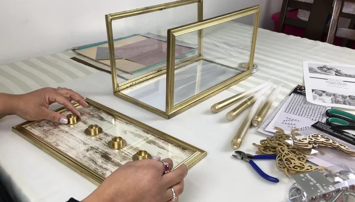 Attach LED lights: Spray paint the bottom of the LED tea light pack and adhere them to the glass using hot glue.