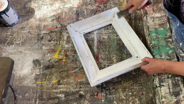 Lightly sand the entire frame with a scotch pad to smooth any rough edges.