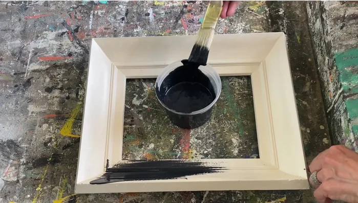 Prepare picture frames: Remove existing artwork or photos.