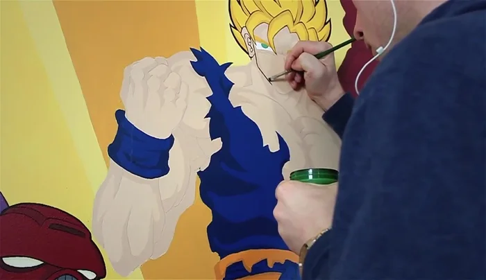 Add line work: Use a small brush and black paint to add line details. Work slowly and carefully, using a damp cloth to correct any mistakes.