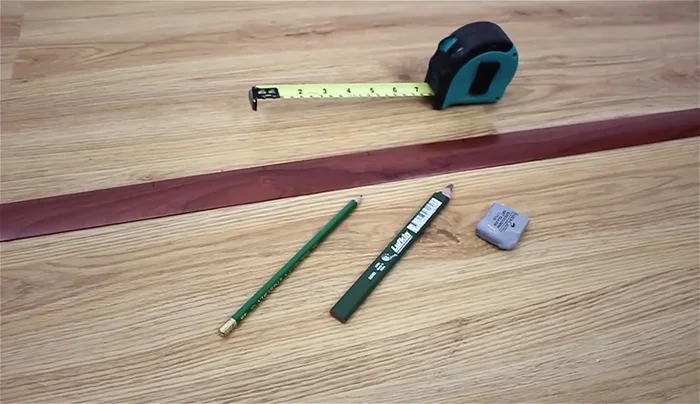 Transfer your design: Replicate each square from your design onto the wall, focusing on one square at a time and carefully mimicking every line and detail to scale.