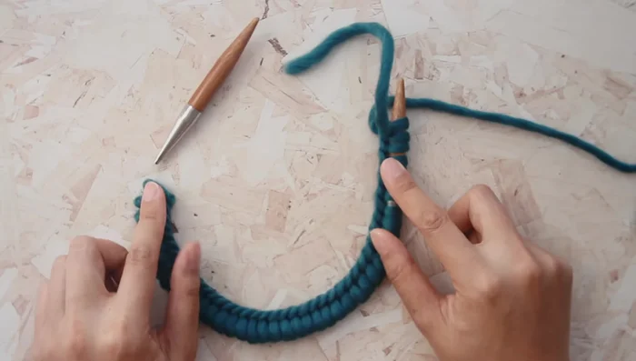 Stretch your cast-on stitches to nearly reach the needle tips.