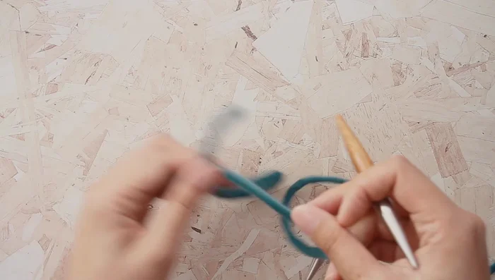 Stretch your cast-on stitches to nearly reach the needle tips.