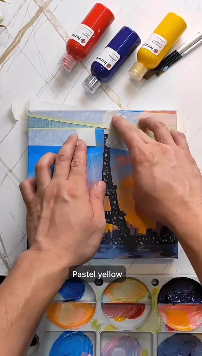 Use tape to create a spotlight at the top of the tower with pastel yellow.