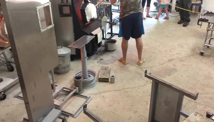 Roll and smooth the gathered glass, allowing it to settle. Trap air inside to create a bubble, then smooth it out.