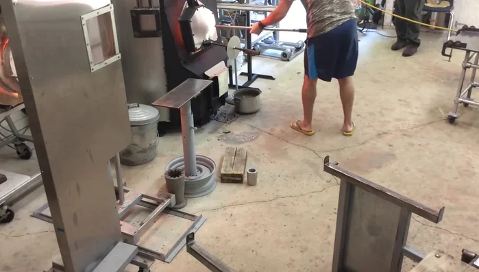 Roll and smooth the gathered glass, allowing it to settle. Trap air inside to create a bubble, then smooth it out.