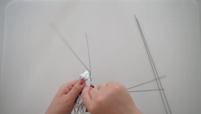 Wrap the last floral wire around the top of the foil body; this is where the wings will attach.