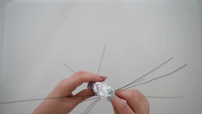 Wrap the last floral wire around the top of the foil body; this is where the wings will attach.