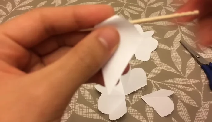 Use a skewer or toothpick to curl each petal outward, then curl inwards from one side to create a spiral effect.