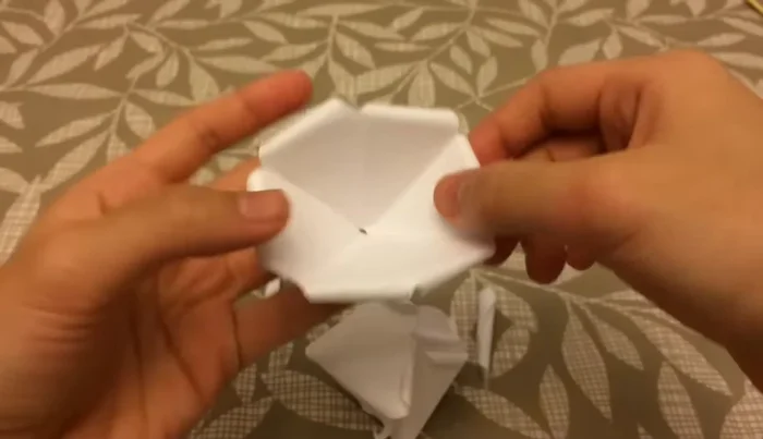 Assemble the rose by layering the petals, gluing the smaller petals inside the larger ones. 