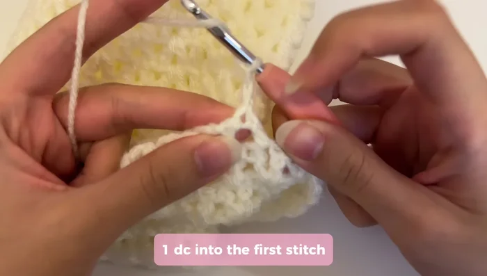 Continue creating rows for the straps, chaining two and turning at the beginning of each row. Repeat the V-stitch pattern, adjusting the last stitch to seamlessly connect to the bag.