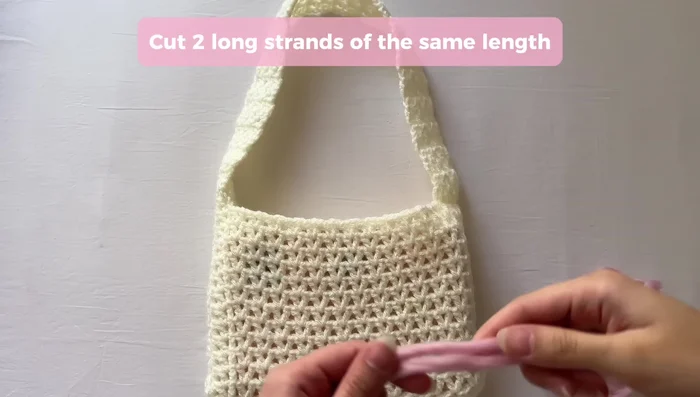 Optionally, thread ribbon or yarn through the straps and tie bows for decoration.