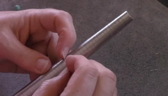 Finalize the ring size and shape: Place the ring back on the mandrel and use a hammer (rawhide or metal) to shape and size the ring to your desired fit. This also helps to harden the wire for durability.
