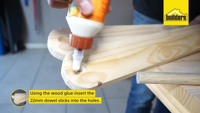 Using wood glue, insert the 12mm dowels into the 22mm holes and secure with wood screws.