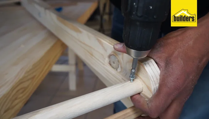 Attach the lacing cord, making knots every 10cm, through the holes in the 12mm dowels.